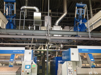 ロールの排気から排熱を回収して、コストゼロで温水を確保